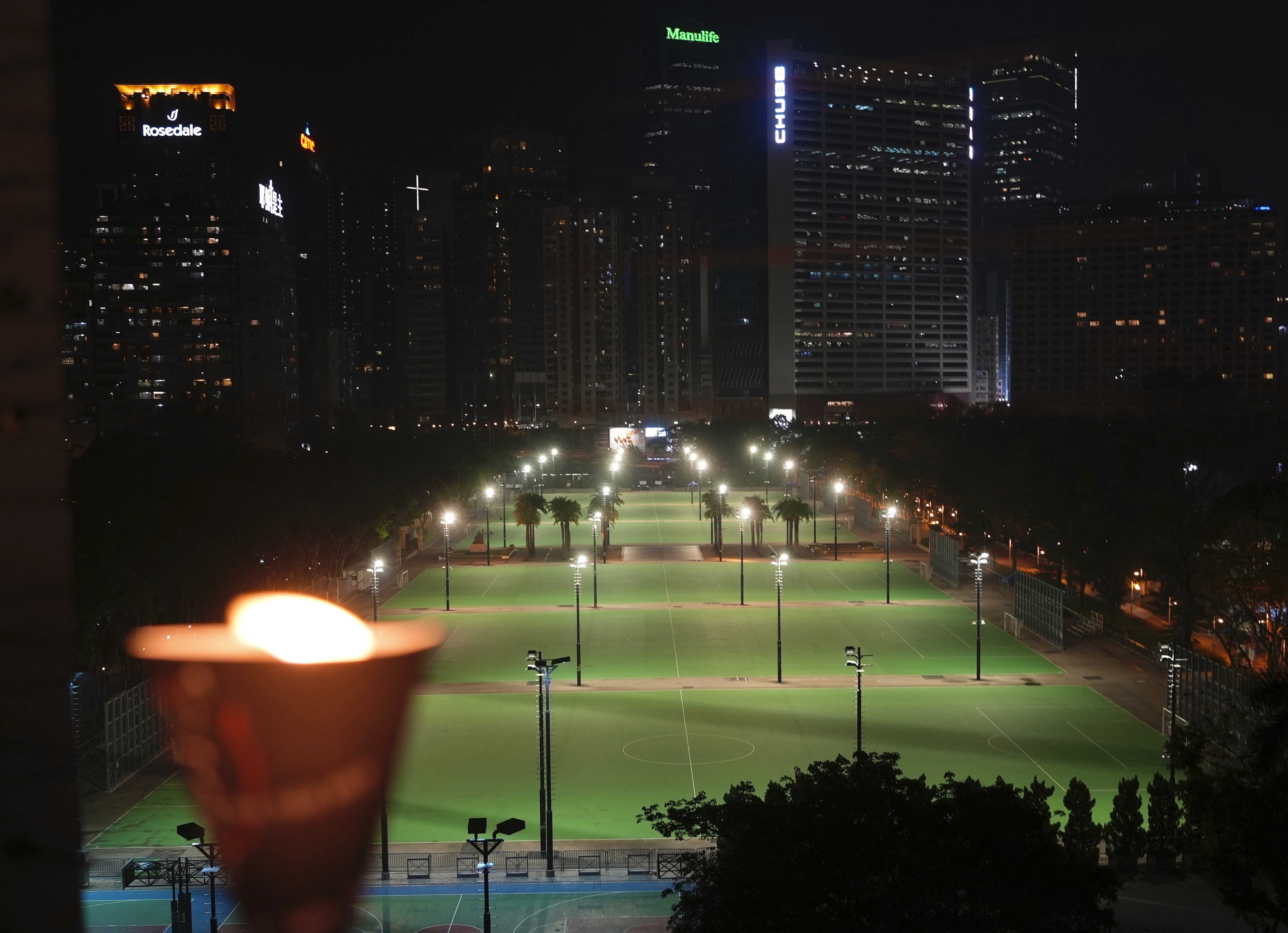 A candle stands near Victoria Park in Hong Kong on Friday, 4 June 2021. People have repeatedly gathered there for a vigil in recent years.