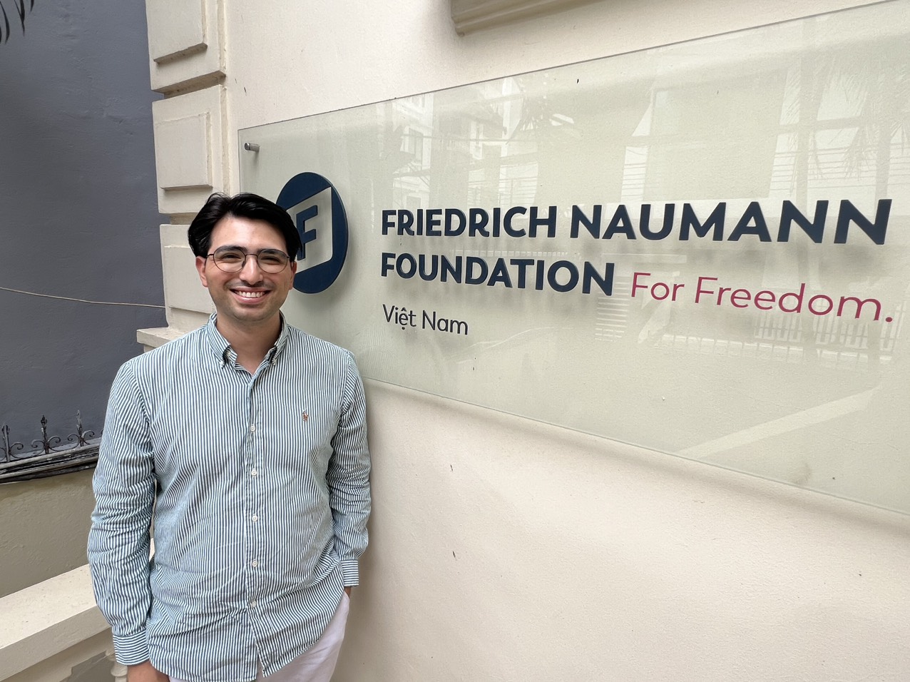 Bugra Kilinc poses outside FNF Vietnam's office