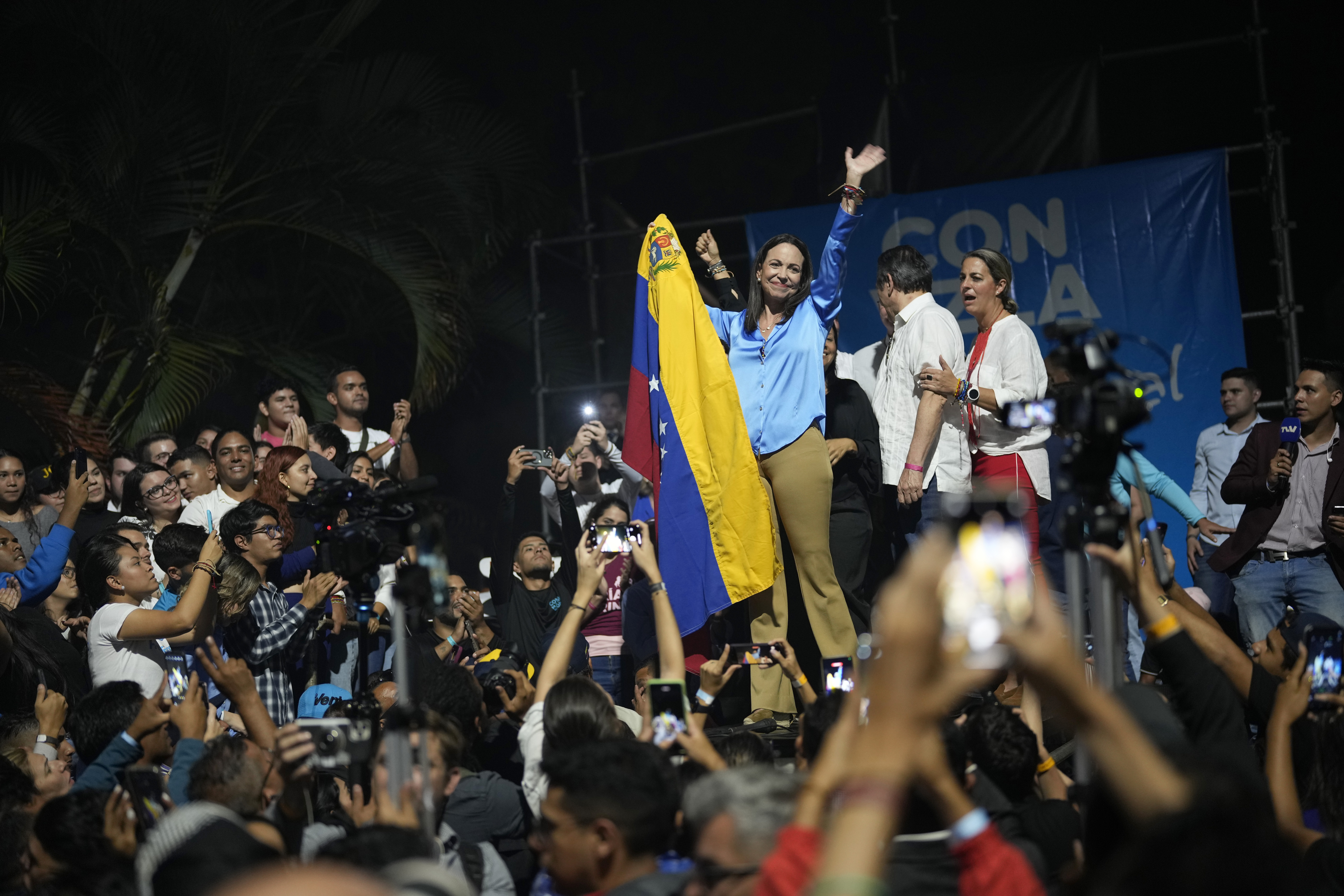 Opposition presidential hopeful Maria Corina Machado celebrates with supporters after listening to the results naming her winner of the opposition primary election, at her campaign headquarters in Caracas, Venezuela,
