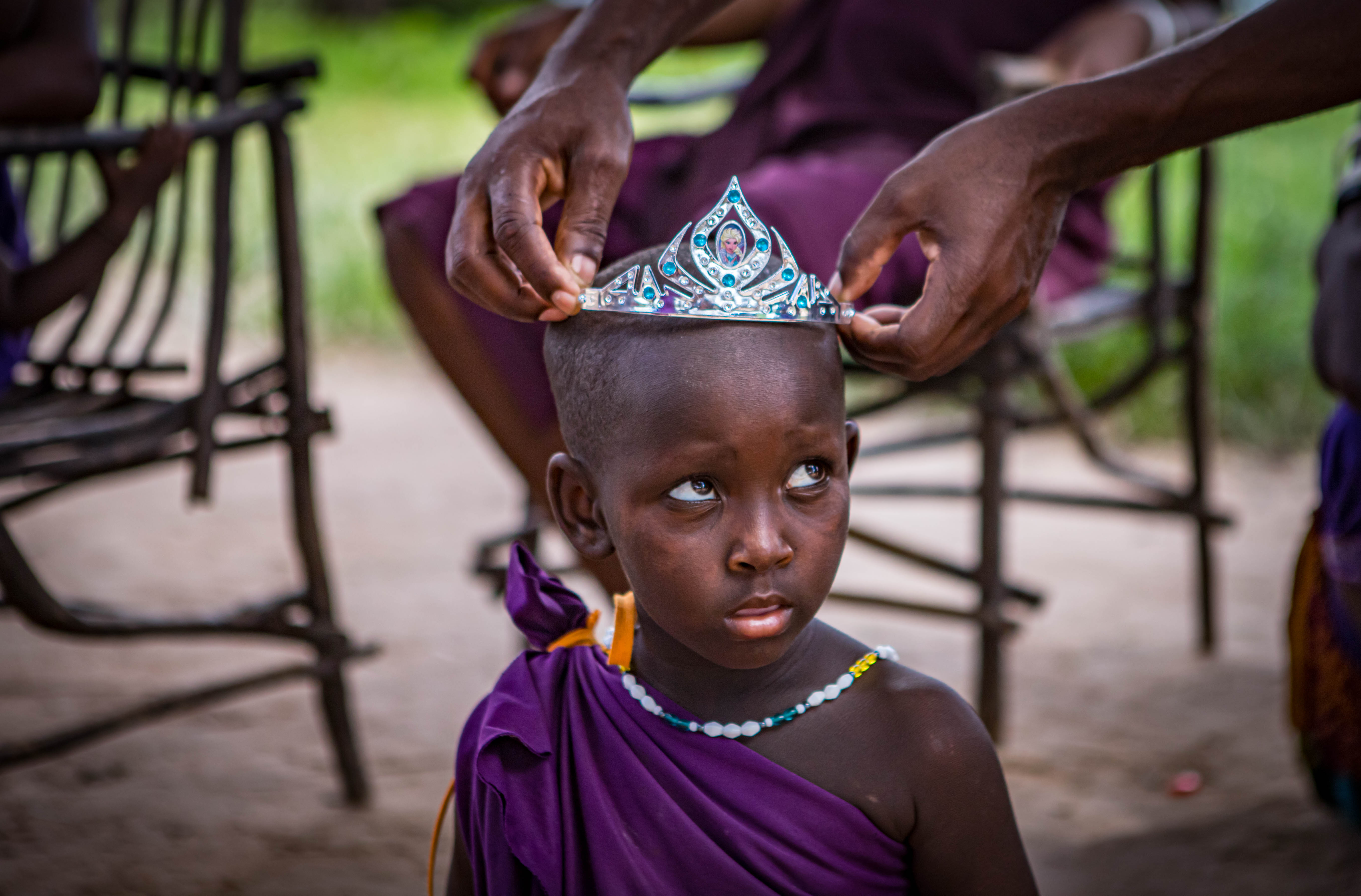 maasai-girl-tries-on-crown-in-tanzania-shutterstock.jpg
