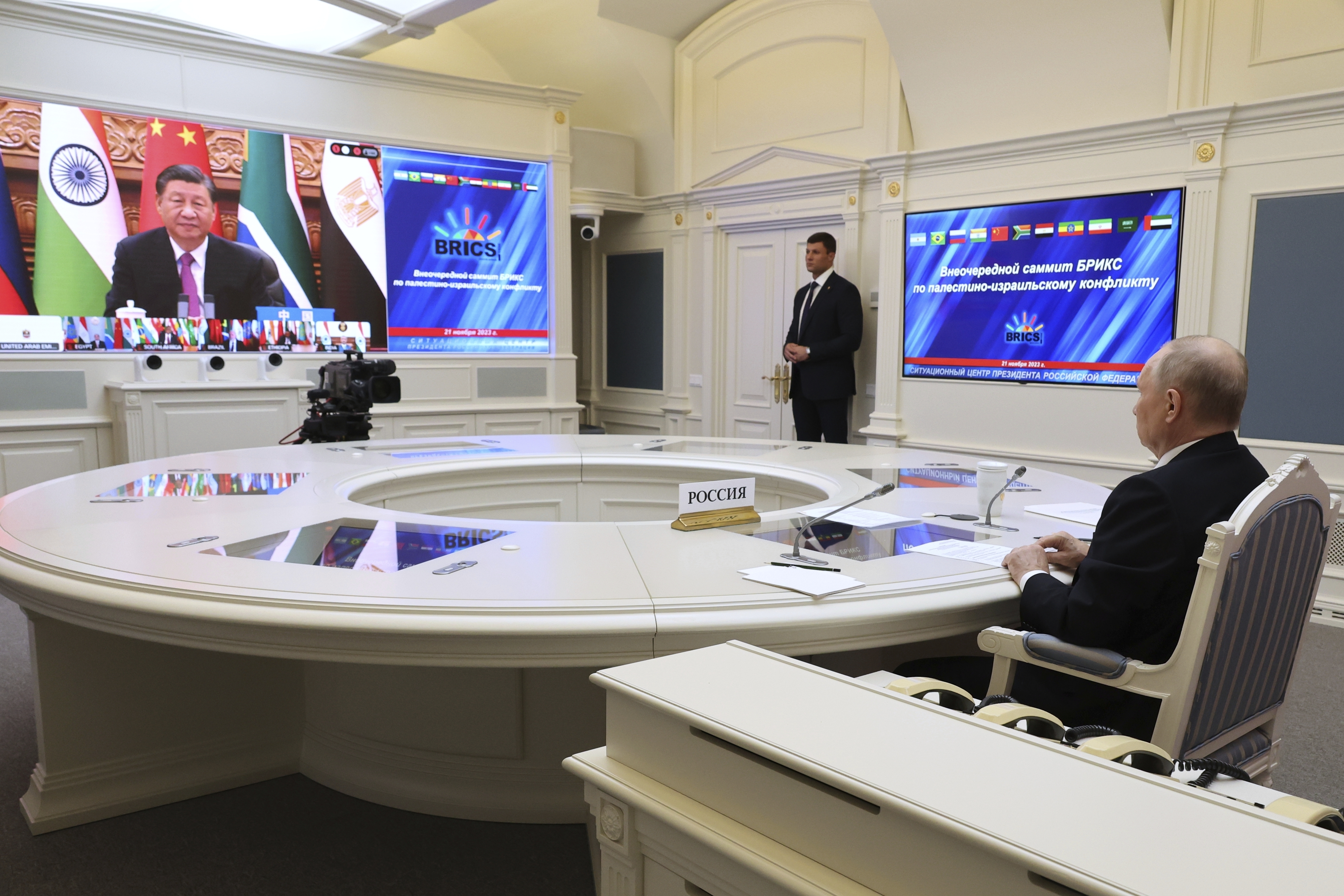 Russian President Vladimir Putin takes part in an extraordinary BRICS summit via video conference, while China's President Xi Jinping can be seen on the screen.