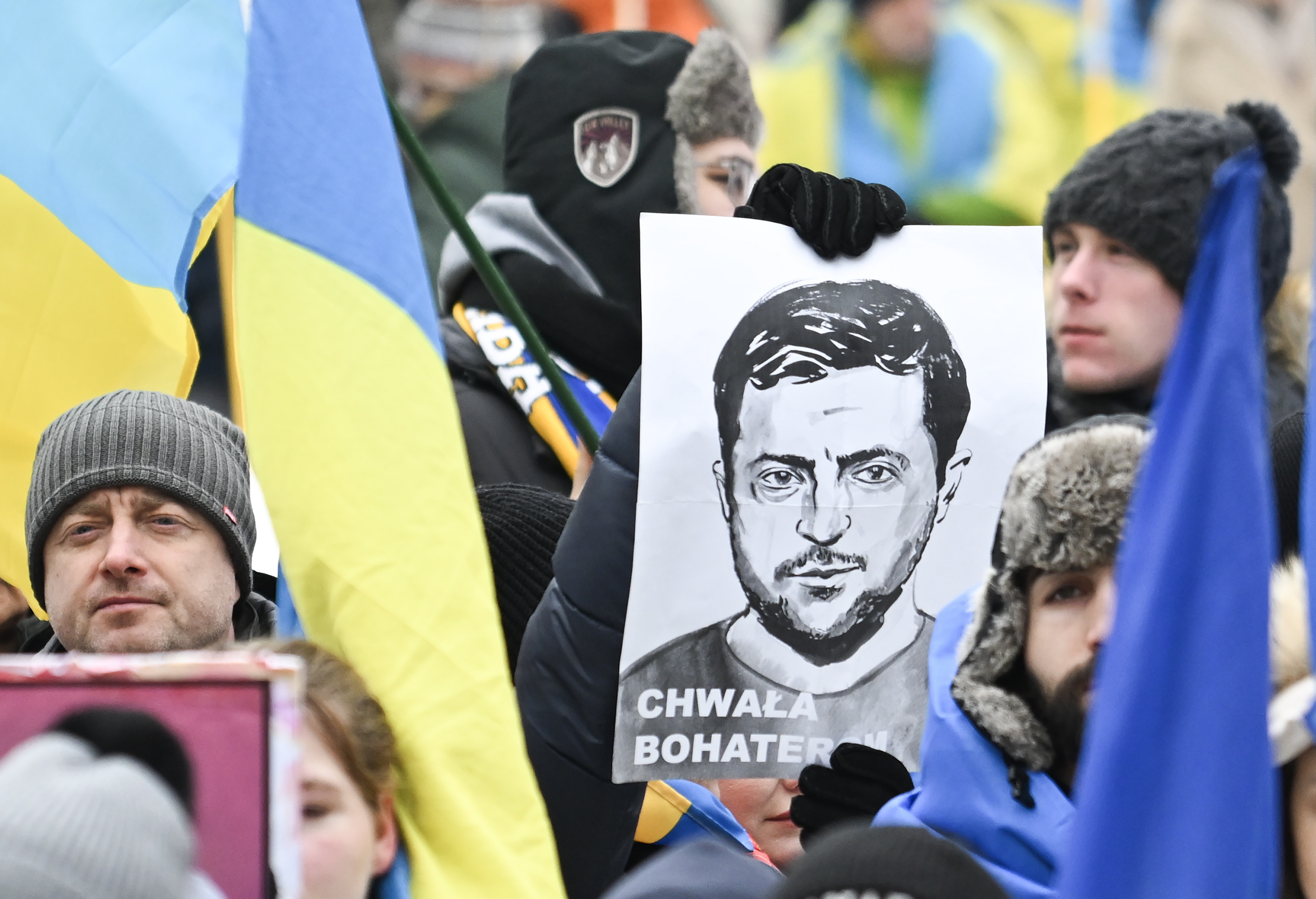 People take part in a protest to mark the third anniversary of the Russian invasion of Ukraine. 