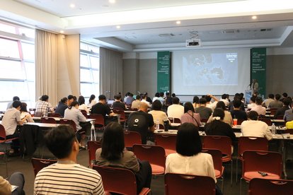 Participants listening to the presentation