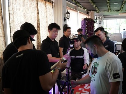 Participants try out mobile filmmaking equipment for making vlogs