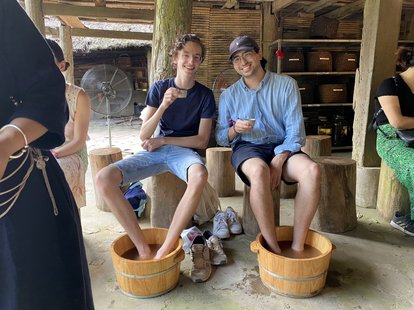 Bugra Kilinc enjoys team outing trip to Thai Nguyen Province with another former intern at FNF Vietnam, Fritz Kuermayr