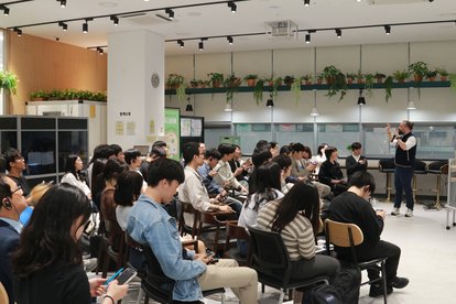 Participants listening to the presentation