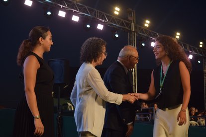 Participants receiving certificates from LAU officials.