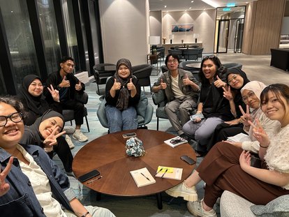 The Pembangkang (Opposition) group preparing their arguments for the debate.