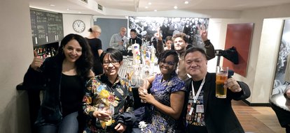 Fun time in the bar, last evening before departure. Prof. Chin-Huat Wong (rightmost) is standing while holding a glass of what looks like a beer.