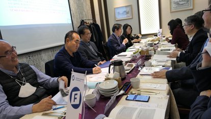 participants are gathered around a table