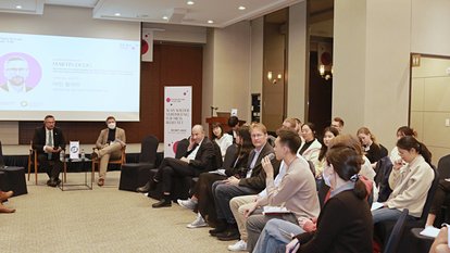 A student is raising a question