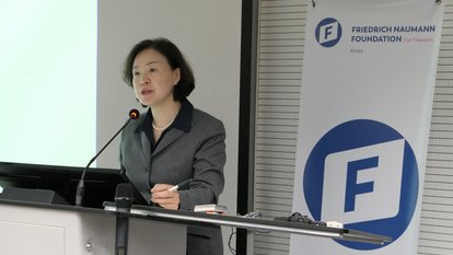 Dr. Lee is delivering her presentation