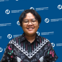 A portrait of Dhea Ramadhani, Program Assistant and Communications Officer of FNF Malaysia. She is seen wearing black Batik and glasses.