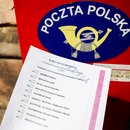 A copy of the 'election package' documents is photographed for illustration photo with Poczta Polska mailbox in the background. Krakow, Poland on May 2nd, 2020. A voting package leaked in the upcoming correspondence election with a full list of candidates for Presidential office and with name and surname statement on secret voting. Despite coronavirus pandemic, Poland's government plans to hold the presidential election on May 10 in the form of a correspondence vote.