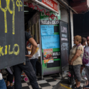 People stand in line in front of a butcher's shop. In the severe economic and financial crisis, the annual inflation rate in the South American country has risen to over 100 percent.