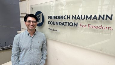 Bugra Kilinc poses outside FNF Vietnam's office