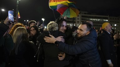 Supporters of the same-sex marriage bill, react during a rally at central Syntagma Square, in Athens, Greece