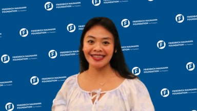 A photo of Ganes Woro Retnani wearing white shirt. She has long, dark hair.