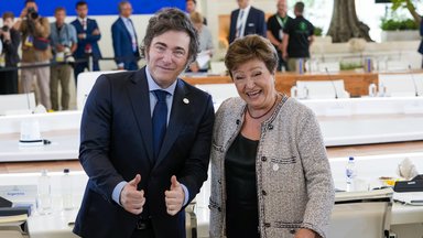 Argentina's President Javier Milei, left, gestures for photographer next to Head of the International Monetary Fund, Kristalina Georgieva